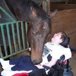 A racehorse brings joy to a disabled child