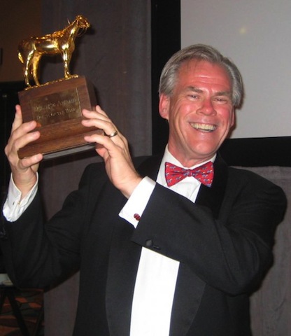 Paulick holds Curlin's Horse of the Year trophy
