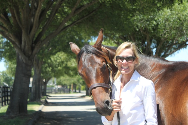 Jan Vandeboss poses with an OTTB filly 