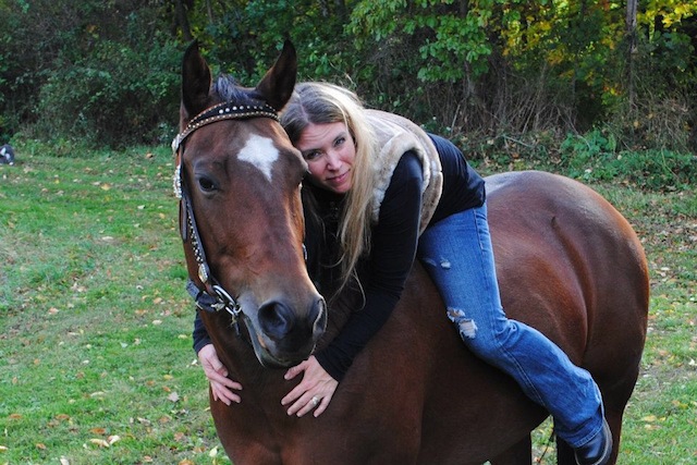 Jackie Harris, a barrel racer and founder of Dreaming of Three, with her mare Sis