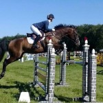Leah Lang-Gluscic and AP Prime power through the showjumping competition at the Richland CIC**