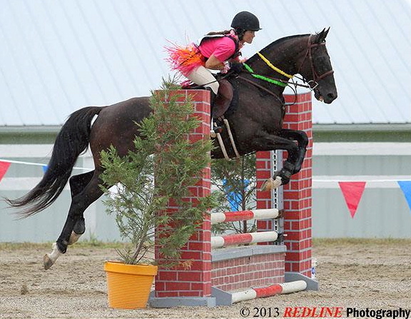 The pair has a natural flair for jumping. Photo by Redline Photography and courtesy Kaymarie Kreidel