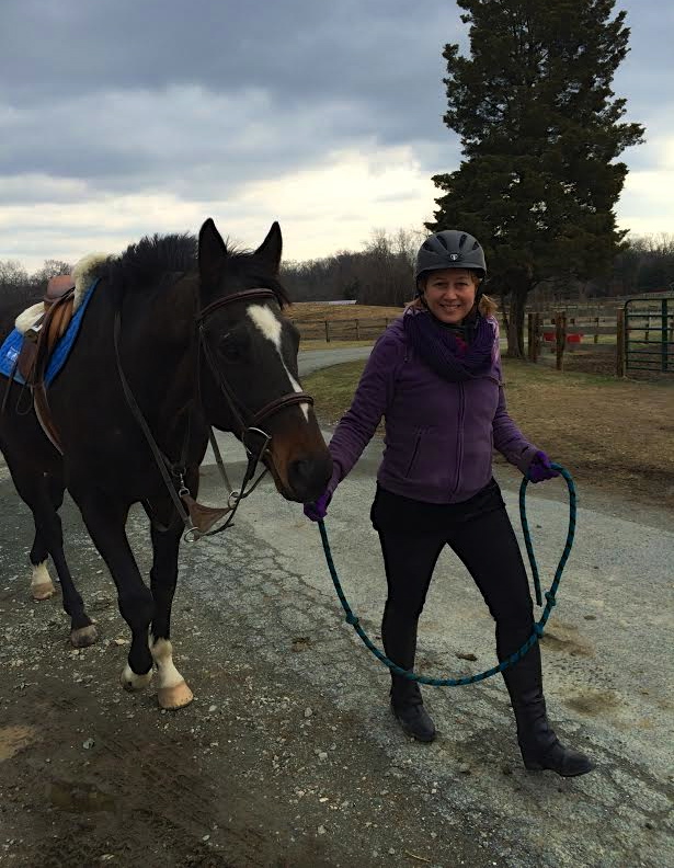 Nancy Perry, senior vice president of government relations of the American Society for the Prevention of Cruelty to Animals beams with her new OTTB, Atticus