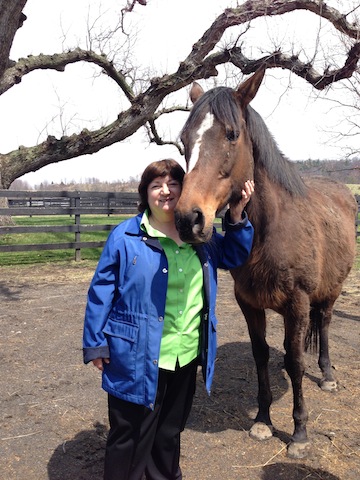 Susan Wagner, president and founder of Equine Advocates, hosted the 2014 American Equine Summit April 26 and 27. Here she is with Press Exclusive, the race mare who earned close to a half-million on the track, then delivered nine live foals, before she nearly died en route to a slaughterhouse. Press is  now in permanent sanctuary with Wagner.