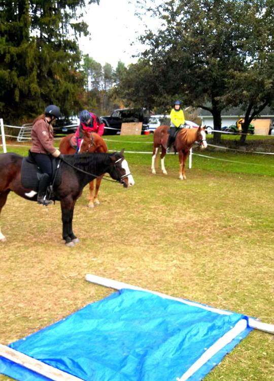 Students and horses face a number of obstacles, including this tarp, and learn to trust each other.