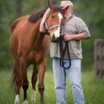 Ron Krajewski poses with his famous painting horse, Metro Meteor. Photo courtesy Wendy Wooley/ Equi Sport Photo