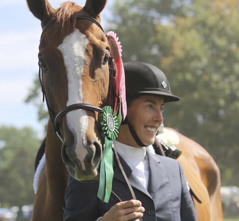 Denise and JJ ribbon at their first show, a year after she adopted the unwanted gelding off the track.