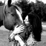 Anne Feltt kisses MG Actor, a Thoroughbred she rode to the Unadilla Auction with over 10 years ago, and then saved when she realized his fate.