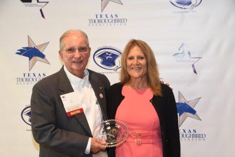 Texas Thoroughbred President Hal Wiggins presents the TCA Award of Merit to Jennifer Gibbs of LOPE. Photo credit: Gay Glazbrook
