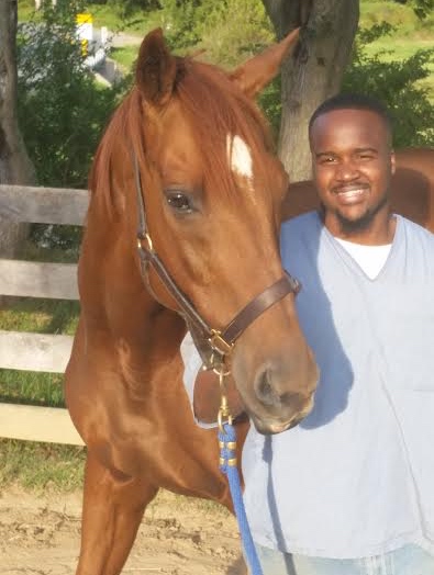 Tim Brooks, a graduate of the Thoroughbred Retirement Foundation's Second Chances program, has gone to work for Steuart Pittman of the Retired Racehorse Project. Pictured with Reds, an OTTB who changed his life.