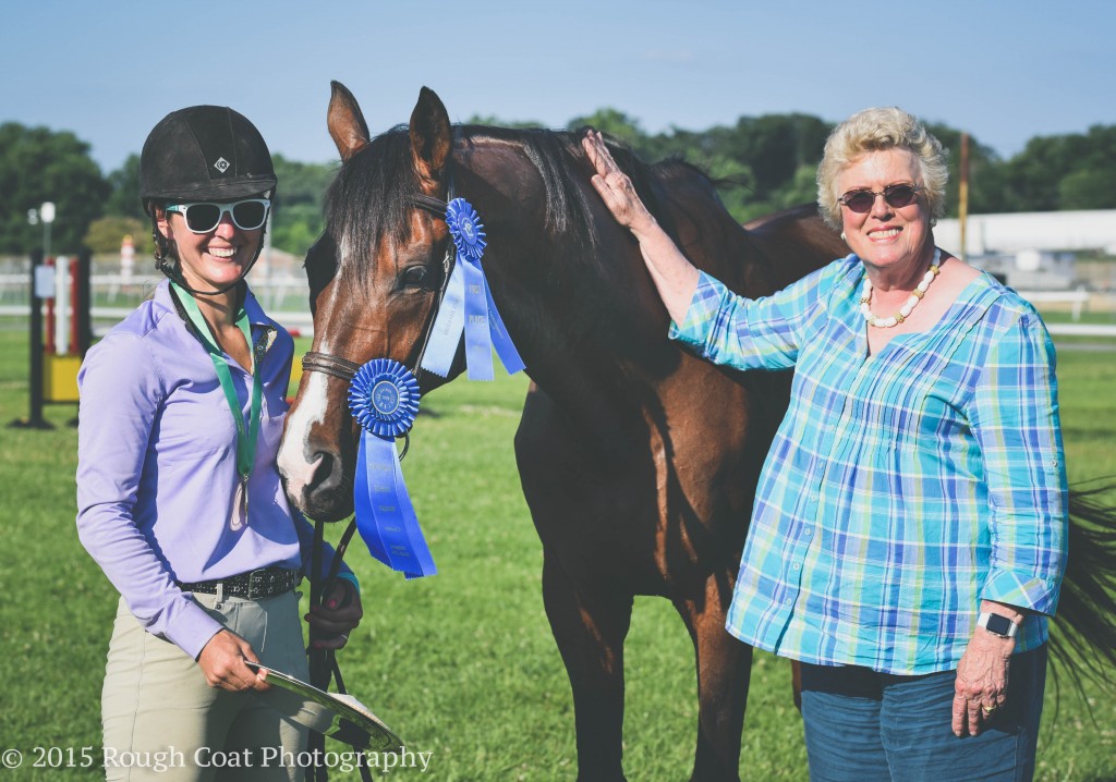 Mrs. Ellen Charles, owner of Hillwood Stables LLC, presenting the trophy to Rachael Lively and Bet A Quarter winners of the $7,500 Hillwood Stable Jumper Speed Stake (3’7”). Photo: MJC/Rough Coat Photography