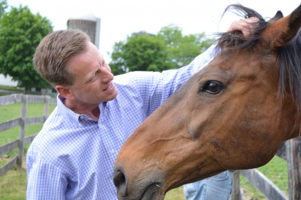 C.L. Rib communes with Hall of Fame jockey Richard Migliore of the Thoroughbred Retirement Foundation.