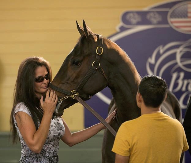 Donna Keen, pictured with a racehorse at the Breeders' Cup, helped get a California bred retired to her original breeder. Terri Cage Photography
