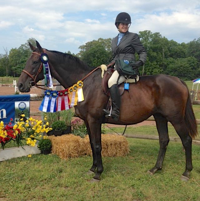 Blessed did so well with her new  owner Eli Hess that she carried this other young rider over cross rails for blue ribbons.