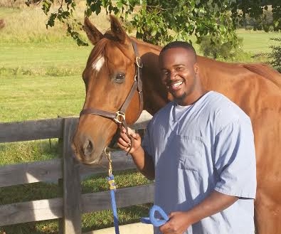 Tim and Reds pose on graduation day from the TRF’s Second Chances program.