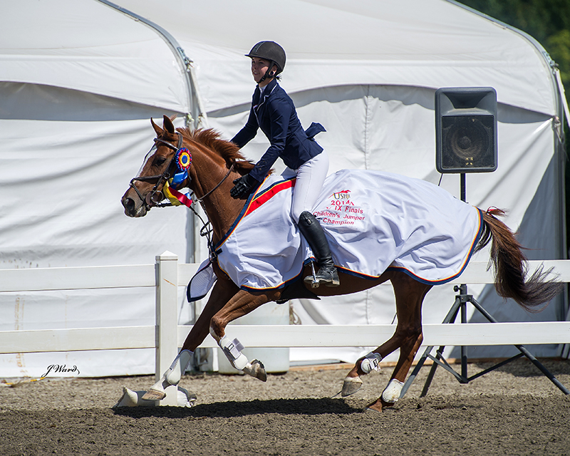 The victory gallop at the USHJA Zone 9 High Children's year end jumper finals in August 2014. Photo by Julie Ward and courtesy Jorji McEllrath