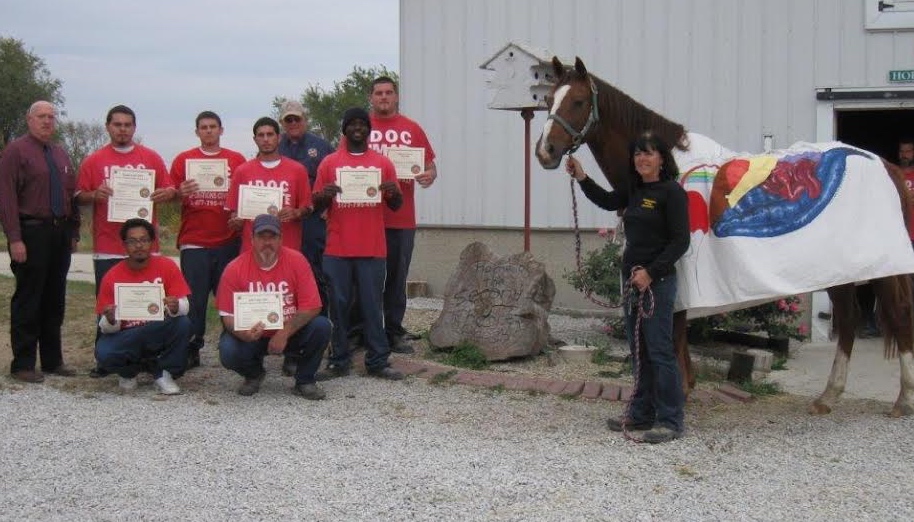 Good Work— Wheeler poses next to a recent group of Second Chances graduates from Vandalia.