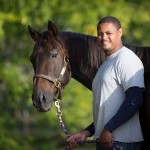 Tamio Holmes became a professional farrier after discovering a natural talent at the James River Work Center in Virginia. Pictured with Secretariat's grandson, Covert Action. Debby Thomas Photography