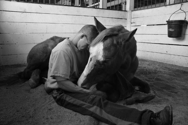 Will Wilson, a former inmate with the James River Work Center in Virginia, shares a moment with Hap's Online. Today, Wilson is a professional farrier. Photo by Karen Ryan
