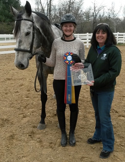 Nicki Wheeler of the TRF presents the high-point award to Turbo Pup and rider Kim Klocke.