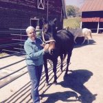 Anne Tucker, pictured with Thoroughbred Retirement Foundation retiree Covert Action, says she was deeply touched by a generous donation from high school students.