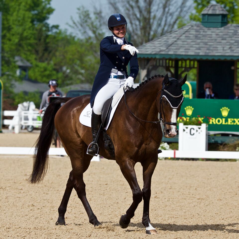 Lang-Gluscic beams her pleasure following their dressage at Rolex.